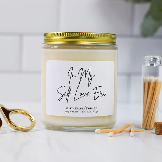 in my self love era candle with gold lid 