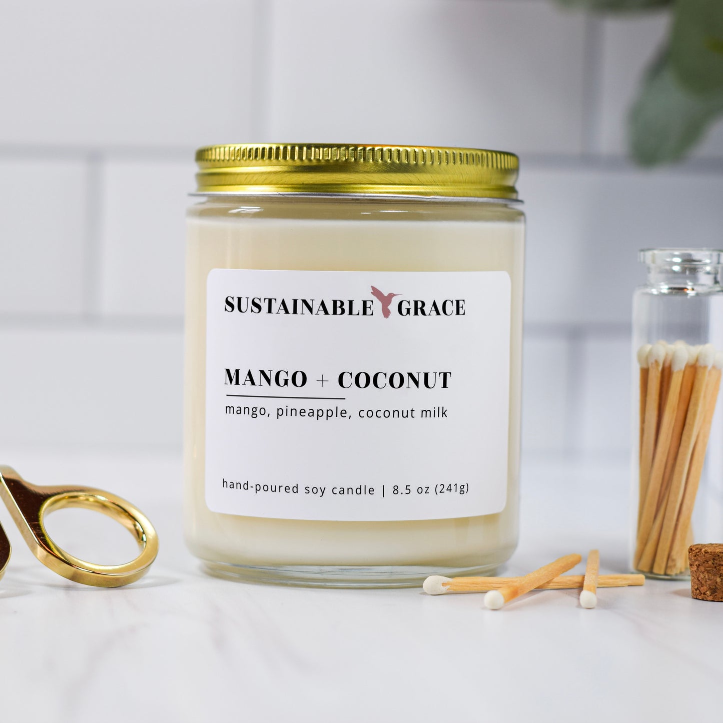 mango + coconut candle with gold lid from sustainable grace 